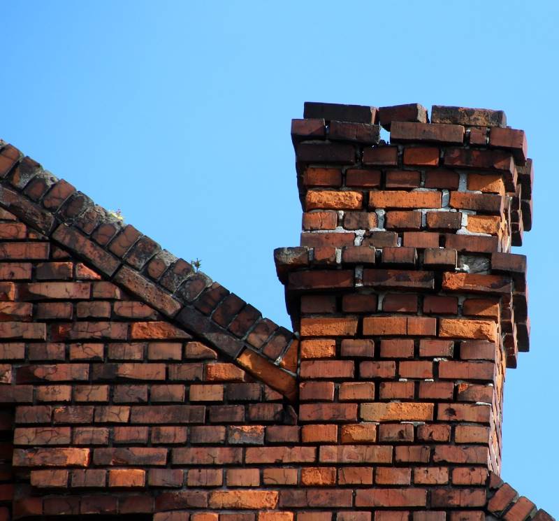 Signs Your Hanover Park Home Needs a Chimney Inspection Damaged chimney on an Hanover Park home showing cracks and missing mortar